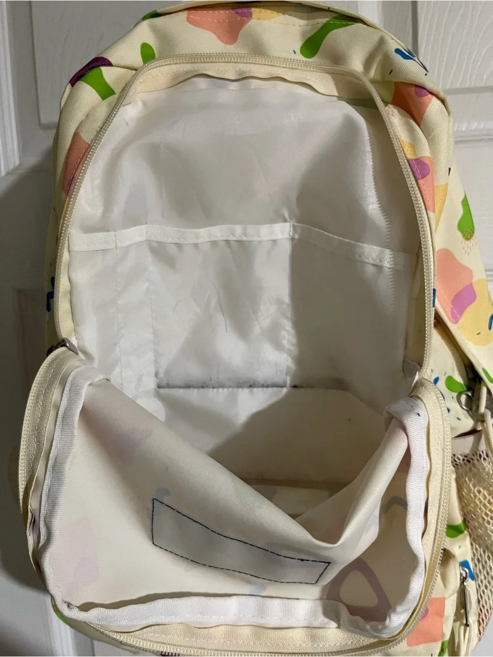 Jansport Cream Backpack with Multicolor Geometric Print